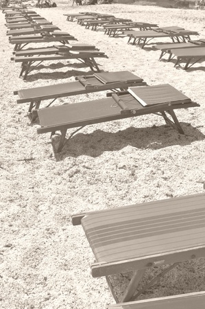 Shore or beach with sun umbrella and or deckchairsの写真素材