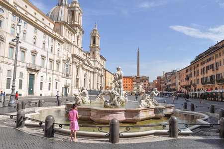 ROME, ITALY - JUNE 24, 2014: Tourists visiting the Fontana dei Quattro Fiumi meaning Fountain of the Four Rivers in the Piazza Navona square designed in 1651 by Gian Lorenzo Berniniのeditorial素材