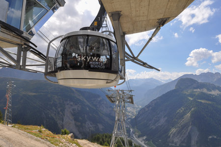 AOSTA VALLEY, ITALY - AUGUST 06, 2015: The new SkyWay aerial tramway links the city of Courmayeur with Pointe Helbronner on the top of Mont Blanc massifのeditorial素材