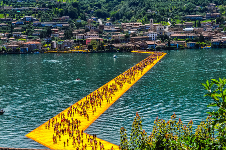 LAKE ISEO, ITALY - CIRCA JUNE 2016: High_dynamic_range (HDR) The Floating Piers site specific artwork by Christo and Jeanne Claudeのeditorial素材