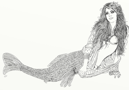 Long-haired mermaid leaning to her side and facing the viewerの写真素材