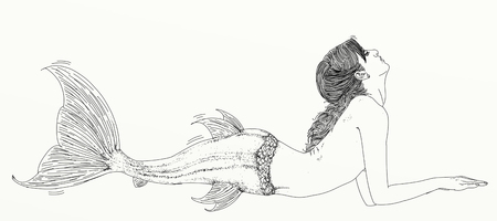 Long-haired mermaid leaning to her side and facing the viewerの写真素材