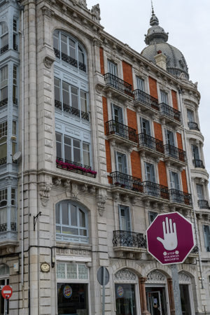 Street sign with a drawing of a hand and a text that reads in Spanish: Stop gender violence. July 6, 2021. Castro Urdiales, Cantabria, Spainのeditorial素材
