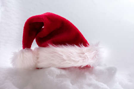 Santa Claus's hat on snow backgroundの写真素材
