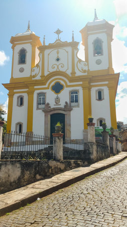 March 25, 2016, historic city of Ouro Preto, Minas Gerais, Brazil, view of the street and facade of the Mother Church of Our Lady of Conception on a sunny day.のeditorial素材