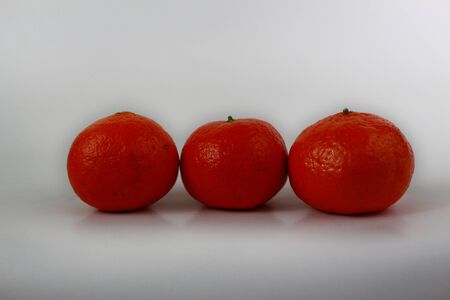 Three tangerine isolated on white backgroundの写真素材