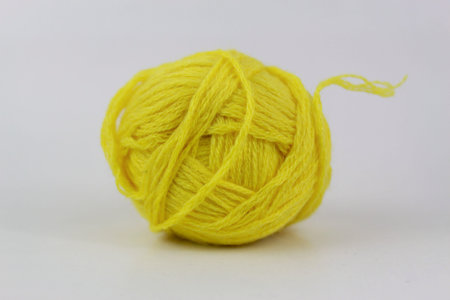Yellow yarn closeup isolated on white background