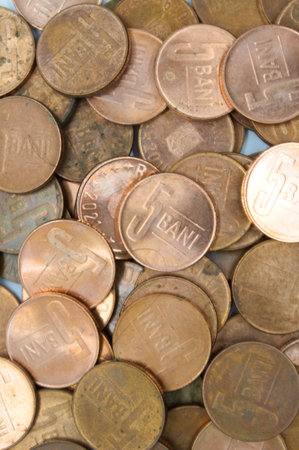 Close-up of 5 bani coins romanian currency with selective focus on foregroundの写真素材