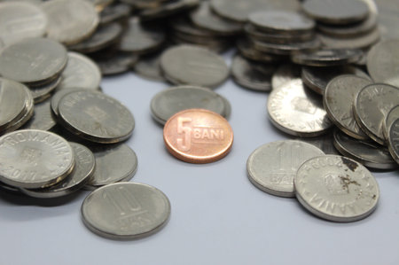 Close-up of Romanian currency coins stack with selective focus on foreground