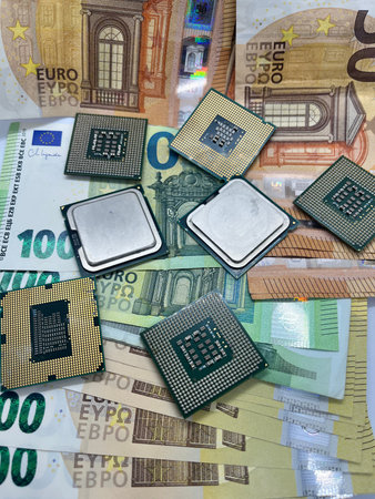 Close-up of golden plated CPUs on Euro banknotes.200 EURO 100 EURO 50 EURO