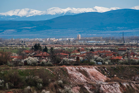 View made over the lake in the former Kremikovtsi mine and views of Sofia and Vitosha Mountain.の写真素材