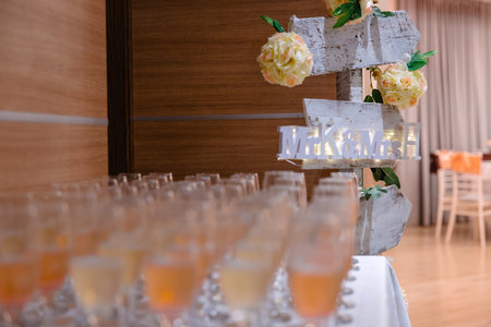 Welcome drinks for a wedding reception. Sign with Mr and Mrs and glass with champagne and wine.の写真素材