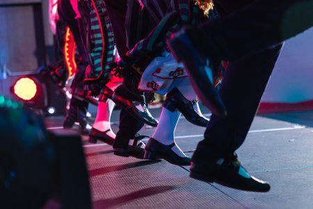 Sofia, Bulgaria - circa 2023 - Traditional Bulgarian dancers on the stage of a conference feet moving in unison.のeditorial素材
