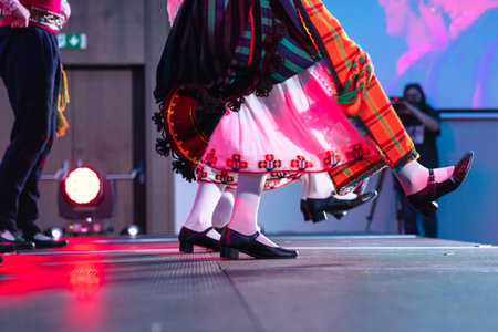 Sofia, Bulgaria - circa 2023 - Traditional Bulgarian dancers on the stage of a conference feet moving in unison.のeditorial素材