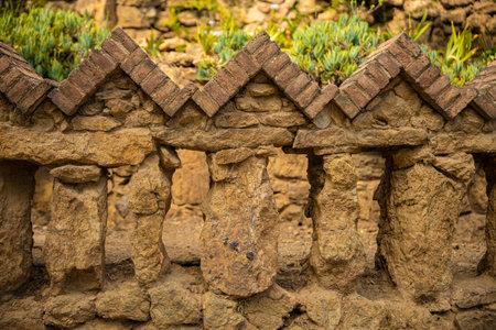 Beautiful brick fence near the house-museum in the Park Guell in Barcelona. Old architecture concept. High quality photoの写真素材