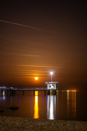 Full moon over the bridge of Burgas cityの写真素材