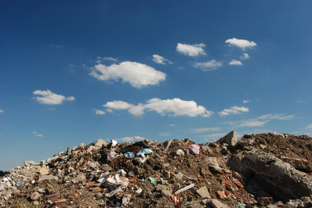 Different waste  over blue sky and cloudsの写真素材