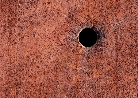 Detail of old rusted door with holeの写真素材