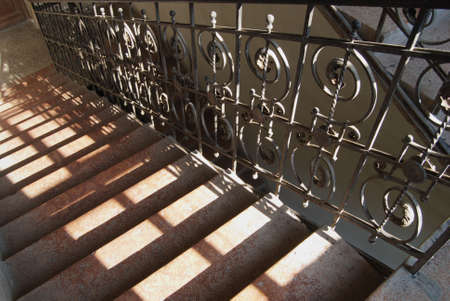 Old stairs with rustic metal fenceの写真素材