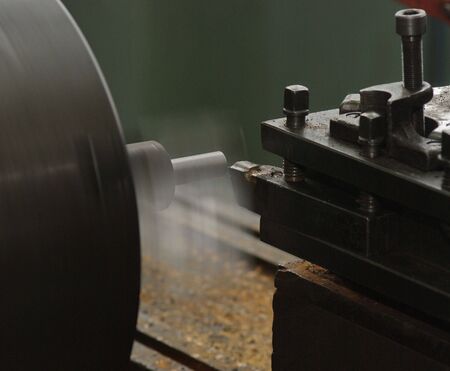Cutting metal on the latheの写真素材