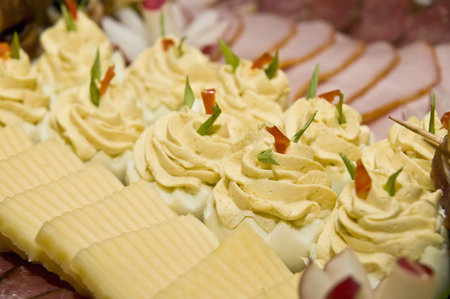 Deviled eggs with cheese and ham selective focus