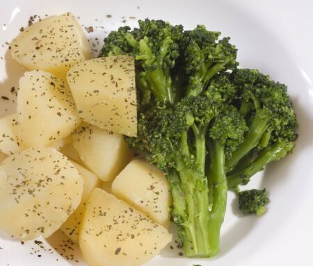 Close up of cooked broccoli and potatoesの写真素材