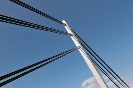 Tower of  cable suspension bridge against blue sky  の写真素材