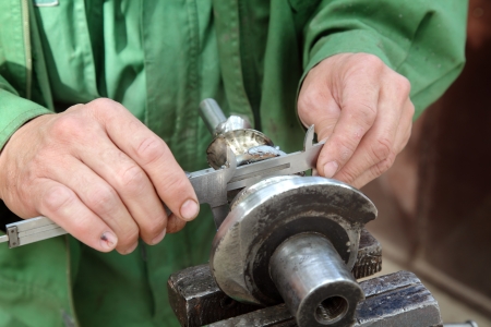 Close up of steel helicoid shaft measuring with caliperの写真素材