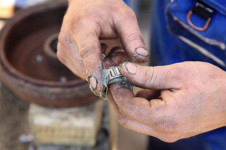 Mechanic lubricate a roller bearing with lithium greaseの写真素材