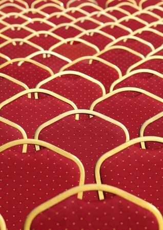 Rows of red upholstered chairs, selective focusの写真素材
