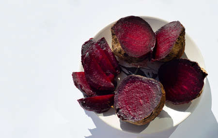 Baked beetroot. The halves are on a plate.の写真素材
