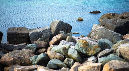 Colored boulders on the seashore. Stones. marine backgrounds. Breakwaters and oceans. coast.の写真素材