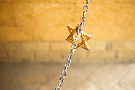 Star of David on a chain. Wall. Copy space for text. Religion Symbols. Signs.