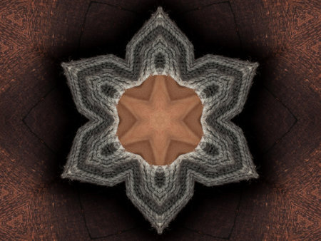 Abstract kaleidoscope background. Beautiful multicolor kaleidoscope texture. Unique kaleidoscope design. with a light brown base color and surrounded by dark brownの写真素材
