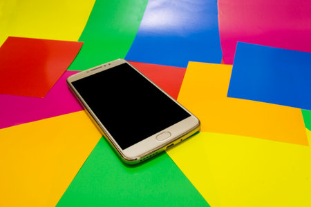 cellphone with a black screen with a colorful background for lgbtの写真素材