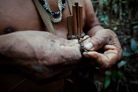 Atalaia du Norde, Amazonia / Brazil - FEB 02 2016:Tribal elder Binan Tukum hunting with his son for monkeys in the rainforestのeditorial素材