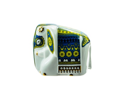 Porcelain statuette of an elephant on a white background.の写真素材