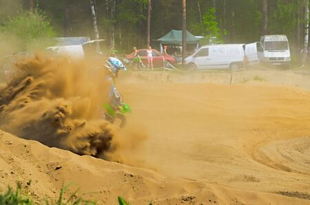 LYTKARINO, MOSCOW REGION, RUSSIA - 18 MAY 2013: motocross cup motor club "Forsazh". Overcoming a sharp turn in the dust.のeditorial素材