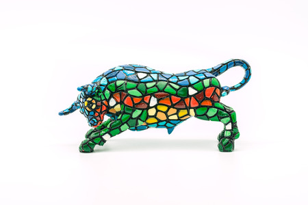 Figurine of a Spanish bull on a white background.の写真素材