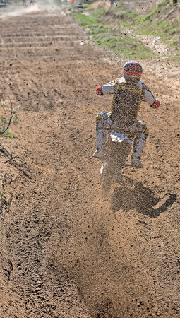 Lytkarino, Russia - April 26, 2014: Riders pass route in action during motorcross motor club Forsazh event in Lytkarino district, Moscow region.のeditorial素材