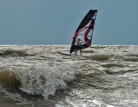 Dolzhanskaya spit, Russia - June 13, 2014: Strong wind in summer attracts many lovers of windsurfing and kitesurfing in the Dolzhanka, Krasnodar region, Russia.のeditorial素材