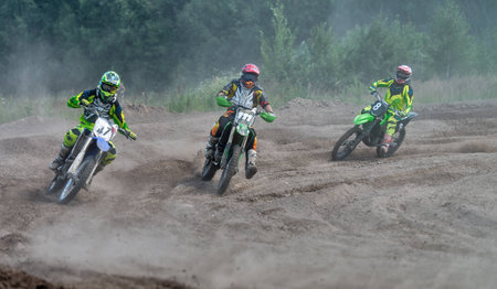 Ramenskoye, Russia - July 20, 2014: Riders pass route in action during motorcross motor club Forsazh event in Ramenskoye district, Moscow region.のeditorial素材