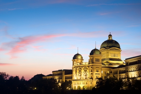 The Federal Palace of Switzerland  Bundeshaus  with red clouds, side view shot  after sunset のeditorial素材