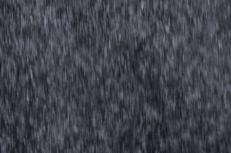 Texture of Falling Water shot from behind a waterfallの写真素材