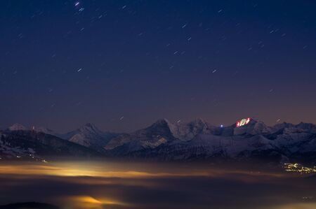Thun, Switzerland - January 12, 2012: Swiss crosses being projected on the face of the Jungfrau as a part of the 100 year festivities of the Jungfrau railway.のeditorial素材