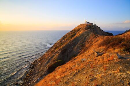 The lighthouse at Cape Emine at sunrise, Black sea coast, Bulgaria. Cape Emine forms the tip of Balkan Mountains. Cape Emine is said to be Bulgaria's stormiest cape.の写真素材