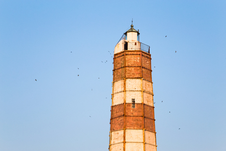 The lighthouse at Cape Shabla on the Black Sea Coast in Bulgaria, the oldest and highest in Bulgaria built during the Crimea War and a popular historic landmark, architecture, travel and tourism conceptの写真素材