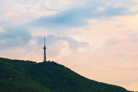 Broadcasting tower on a mountain top viewed at sunset in Sofia, Bulgaria in a communications...