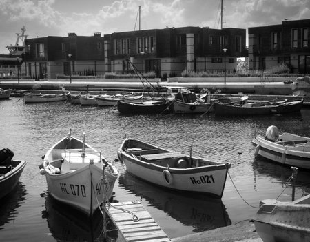 Boats moored in the harbor. Black and white photo.の写真素材