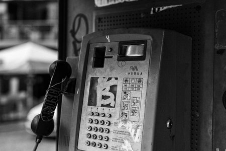 Public telephone booth - black and white image.の写真素材